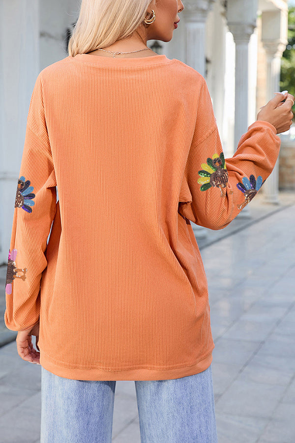 Sudadera holgada de manga larga con estampado de pavo colorido y lentejuelas