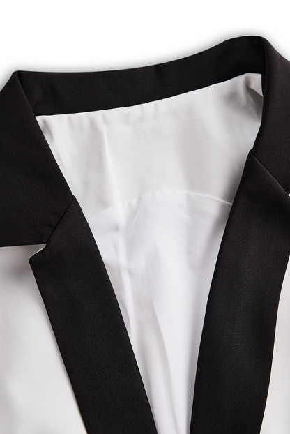 Sleek White Jumpsuit With Dual Button Detail And Black Lapel
