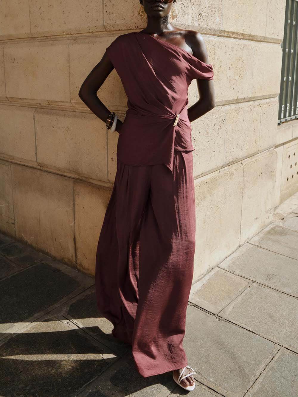 Unique Asymmetric Hem Metallic Accents Top