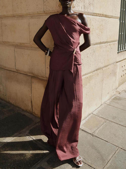 Unique Asymmetric Hem Metallic Accents Top