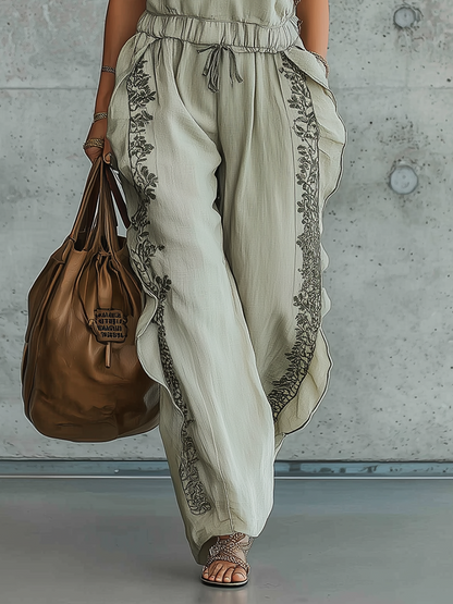 Sleeveless Embroidered Jumpsuit With Ruffled Trim And Relaxed Silhouette