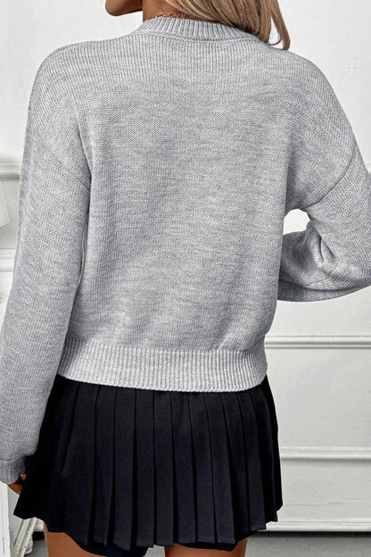 Suéter de punto suelto con cuello redondo y flores 3D 