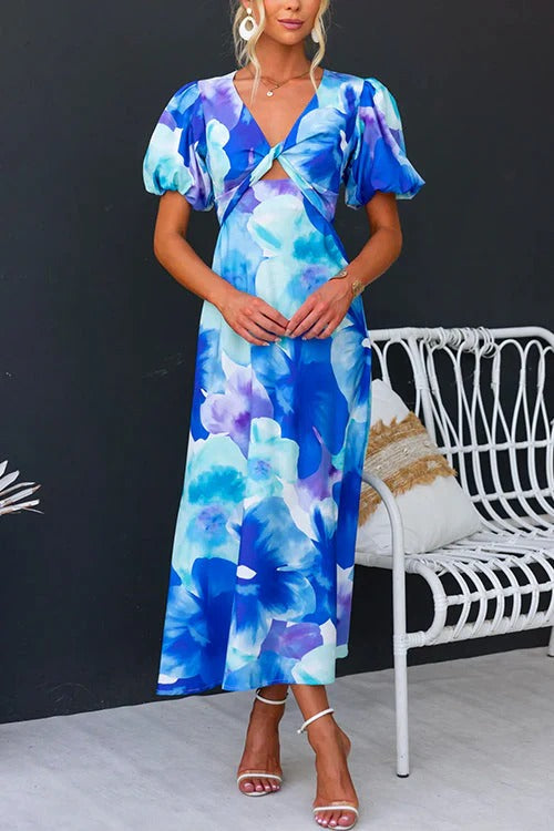 Vestido midi con estampado floral, escote en V, mangas abullonadas y parte delantera torcida 