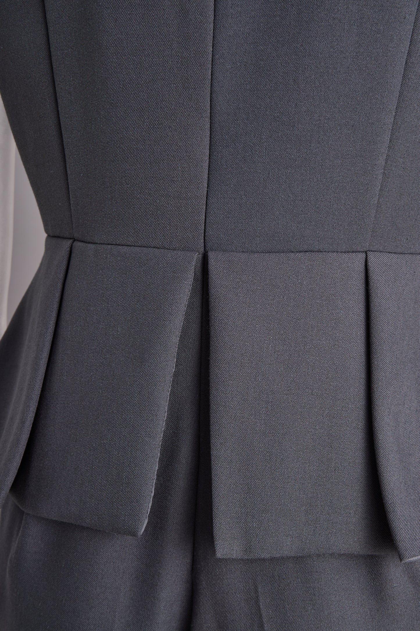 Sophisticated Sleeveless Peplum Jumpsuit In Charcoal Gray