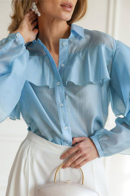 Blusa transparente con volantes 